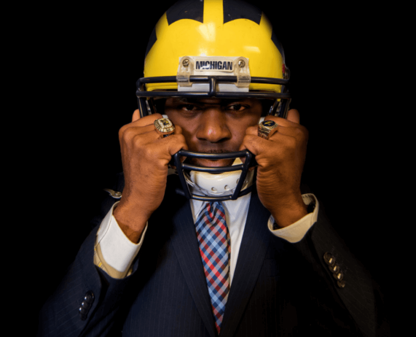 Terrence Quinn Wearing A University of Michigan Football Helmet