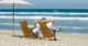 Retired Couple Sitting At The Beach | When Is It The Right Time For Me To Retire | The TGW Law Firm