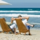 Retired Couple Sitting At The Beach | When Is It The Right Time For Me To Retire | The TGW Law Firm