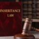 Inheritance Law Book With Gavel Hammer | Leaving Money To Grandchildren | The TGQ Law Firm