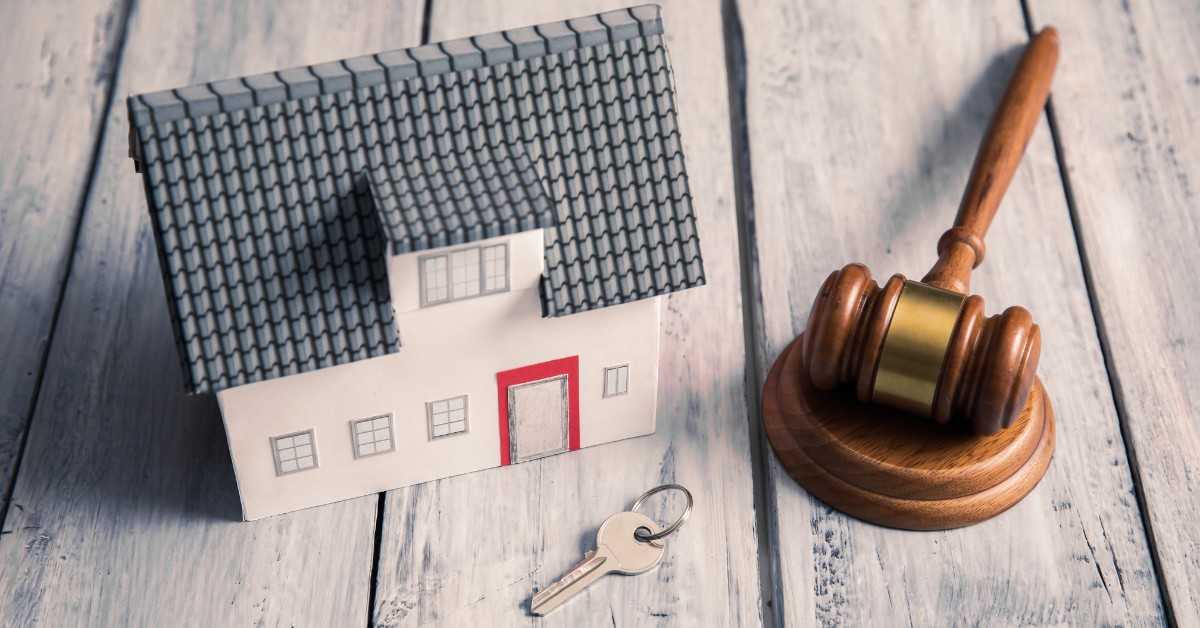 Toy House With Key and Gavel | Retiring With Multiple Properties | The TGQ Law Firm
