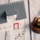 Toy House With Key and Gavel | Retiring With Multiple Properties | The TGQ Law Firm