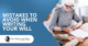 An Elderly Woman Sitting at a Table Signing Paperwork | Mistakes To Avoid When Writing Your Will | The TGQ Law Firm